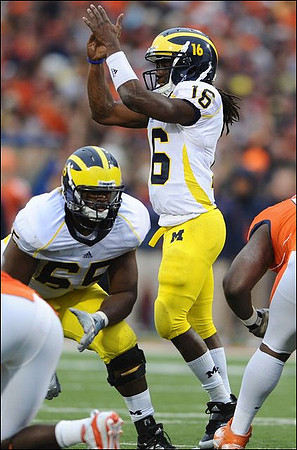 Patrick Omameh (65) and Denard Robinson (16)