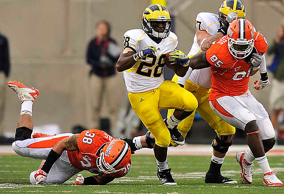Fitzgerald Toussaint (28) and Taylor Lewan (77)