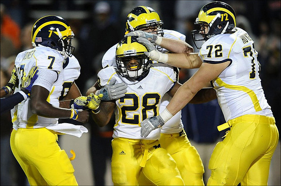 Devin Gardner (7), Fitzgerald Toussaint (28), Michael Schofield (75), and Mark Huyge (72)