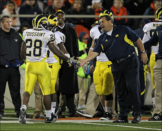 Fitzgerald Toussaint (28), Denard Robinson (16), and Brady Hoke