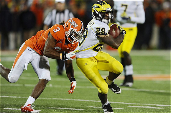 Fitzgerald Toussaint (28) and Devin Gardner (7)