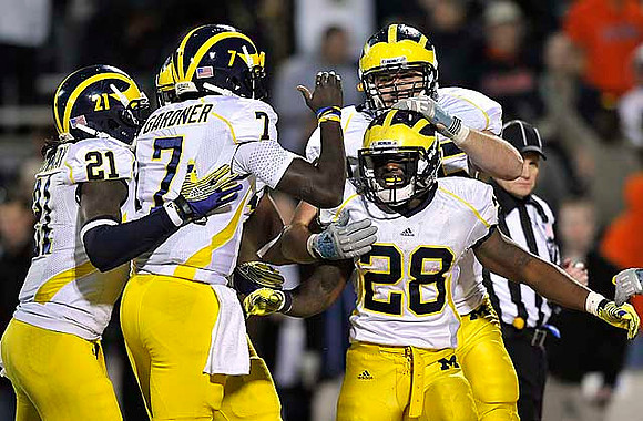 Junior Hemingway (21), Devin Gardner (7), Fitzgerald Toussaint (28), and Michael Schofield (75)