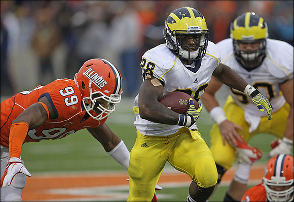 Fitzgerald Toussaint (28) and David Molk (50)