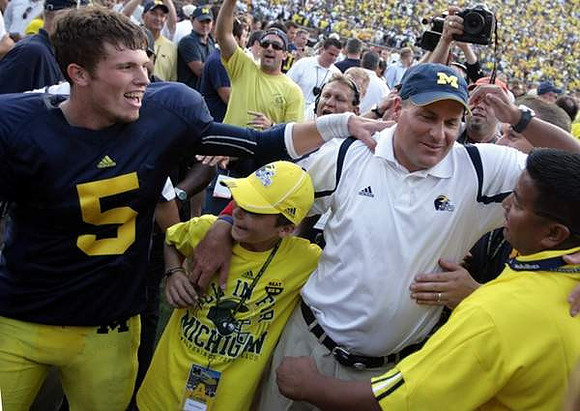Tate Forcier (5) and Rich Rodriguez