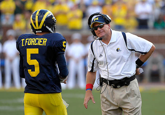 Tate Forcier (5) and Rich Rodriguez