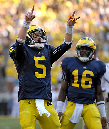 Tate Forcier (5) and Denard Robinson (16)