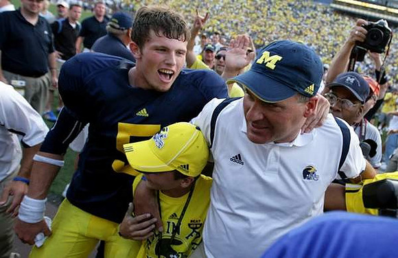 Tate Forcier (5) and Rich Rodriguez