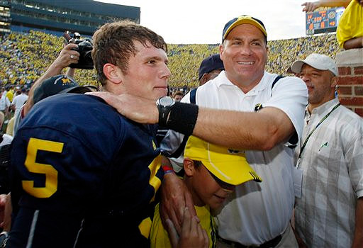 Tate Forcier (5) and Rich Rodriguez