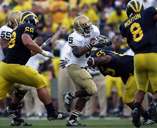 Mike Martin (68), Brandon Graham (55), and Jonas Mouton (8)