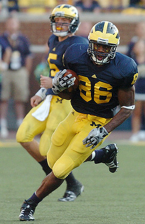 Tate Forcier (5) and Kevin Koger (86)