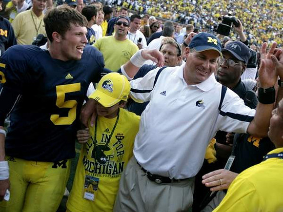Tate Forcier (5) and Rich Rodriguez