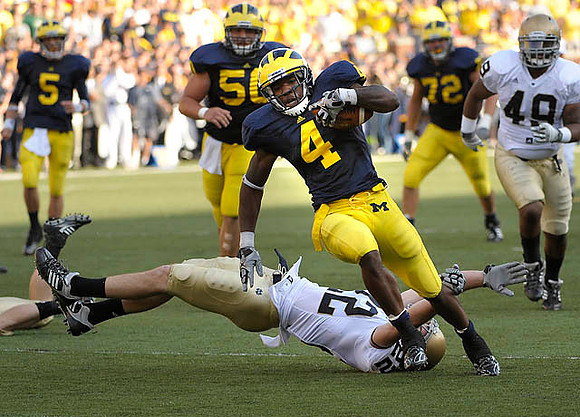 Tate Forcier (5), David Molk (50), Brandon Minor (4), and Mark Huyge (72)