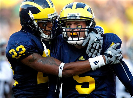 Darryl Stonum (22) and Tate Forcier (5)