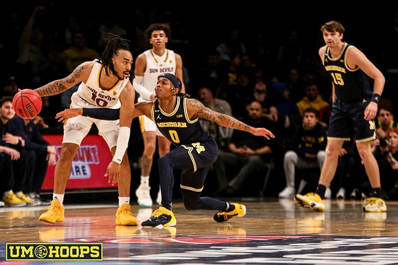 Dug McDaniel (0) and Joey Baker (15)