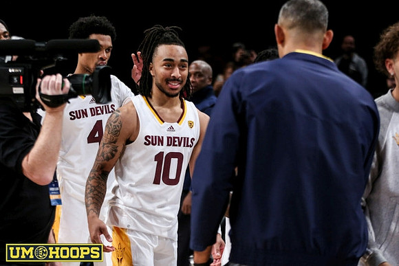 Ex-Wolverine Frankie Collins and Juwan Howard