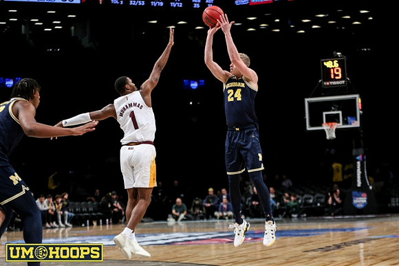 Tarris Reed Jr. (32) and Youssef Khayat (24)