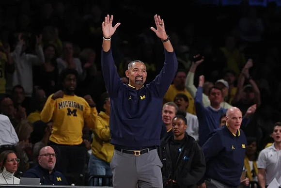 Juwan Howard and Phil Martelli