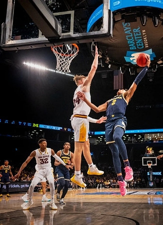 Kobe Bufkin (2), Tarris Reed Jr. (32), and Dug McDaniel (0)