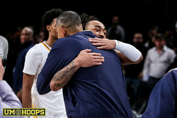 Ex-Wolverine Frankie Collins and Juwan Howard