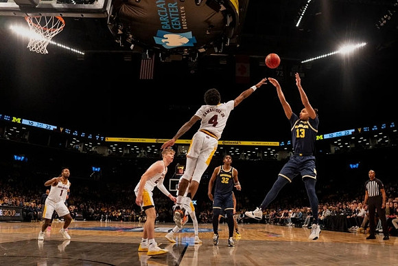 Jett Howard (13) and Tarris Reed Jr. (32)