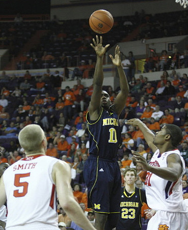 Tim Hardaway Jr. (10) and Evan Smotrycz (23)