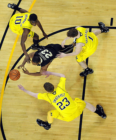 Tim Hardaway Jr. (10), Evan Smotrycz (23), and Stu Douglass (1)