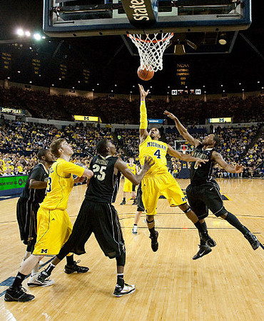 Evan Smotrycz (23), Darius Morris (4), and Stu Douglass (1)