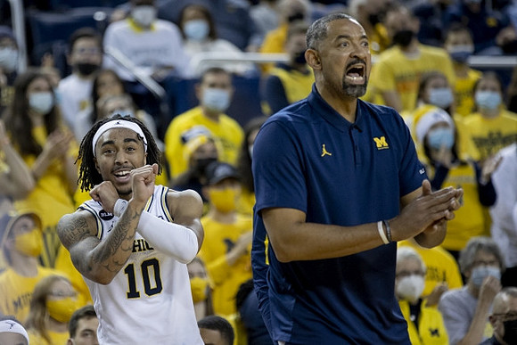 Frankie Collins (10) and Juwan Howard