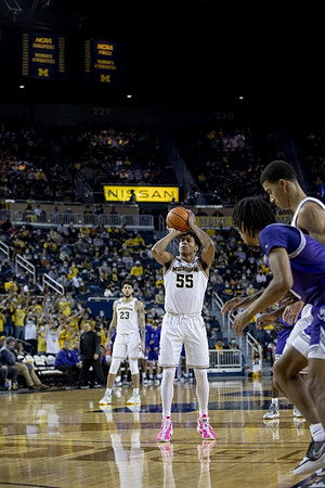 Brandon Johns Jr. (23) and Eli Brooks (55)