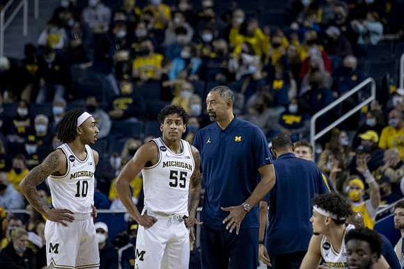 Frankie Collins (10), Eli Brooks (55), and Juwan Howard