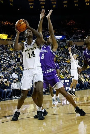 Moussa Diabate (14) and Terrance Williams II (5)