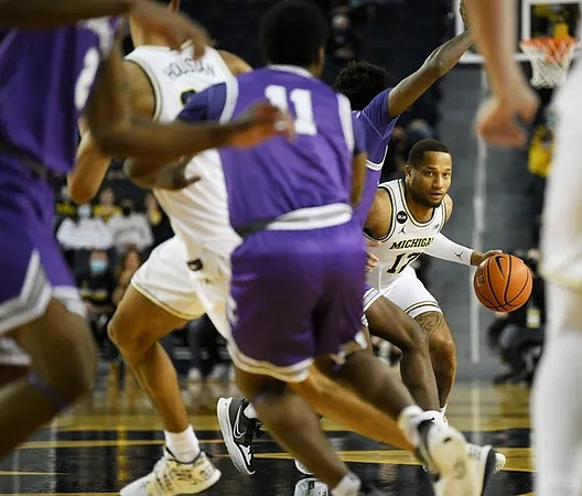 DeVante' Jones (12) and Caleb Houstan (22)