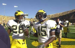 Ryan Mundy (26), Steve Breaston (15), Tim Massaquoi (88), and Leon Hall (29)