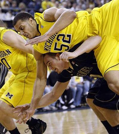 Zack Novak (0) and Jordan Morgan (52)