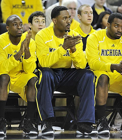 Corey Person (32), Jordan Dumars (2), and Eso Akunne (5)