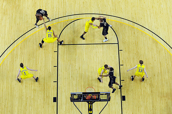 Stu Douglass (1), Jon Horford (15), Darius Morris (4), Zack Novak (0), and Matt Vogrich (13)