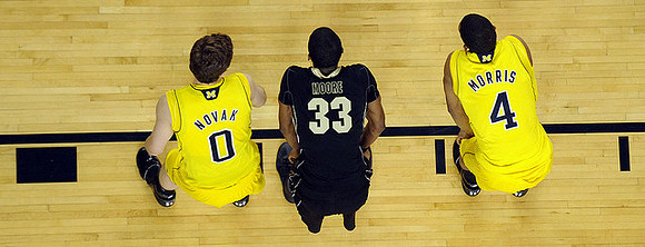 Zack Novak (0) and Darius Morris (4)