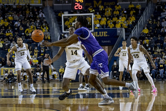 DeVante' Jones (12), Moussa Diabate (14), Caleb Houstan (22), and Eli Brooks (55)