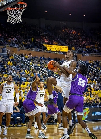 DeVante' Jones (12), Caleb Houstan (22), and Moussa Diabate (14)