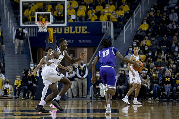 Eli Brooks (55), Moussa Diabate (14), and Caleb Houstan (22)