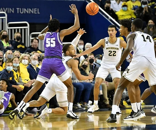 DeVante' Jones (12), Caleb Houstan (22), and Moussa Diabate (14)