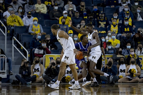 DeVante' Jones (12) and Moussa Diabate (14)