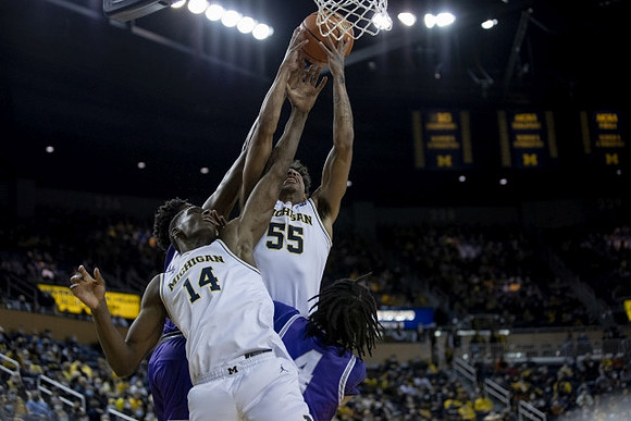 Moussa Diabate (14) and Eli Brooks (55)
