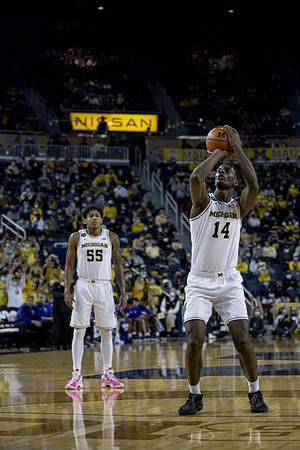 Eli Brooks (55) and Moussa Diabate (14)