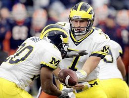 Michael Hart (20) and Chad Henne (7)