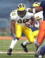 Michael Hart (20) and Chad Henne (7)