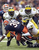 Ryan Mundy (21), Ernest Shazor (25), and Marlin Jackson (3)