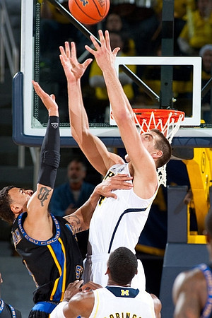 Mitch McGary (4) and Glenn Robinson III (1)