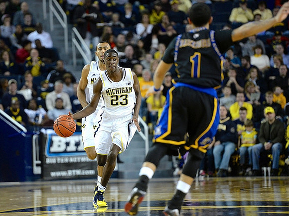 Caris LeVert (23) and Jon Horford (15)