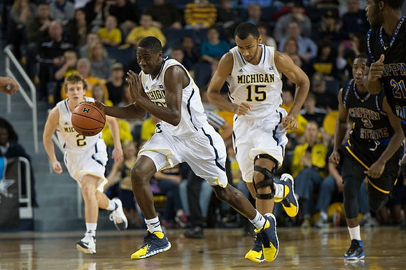 Spike Albrecht (2), Caris LeVert (23), and Jon Horford (15)